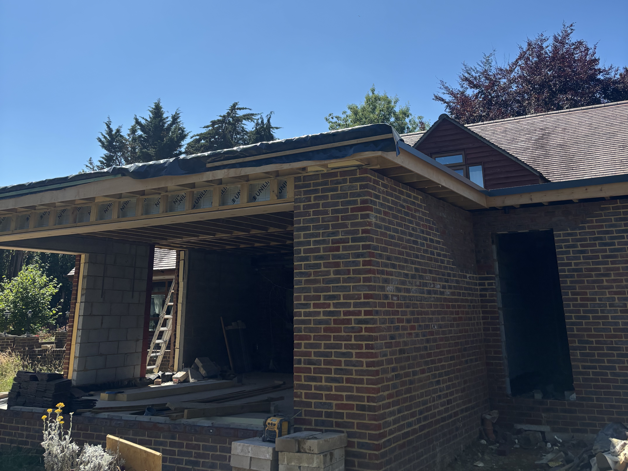 Brick garage under construction.