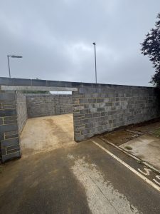 Outdoor brick wall enclosure.